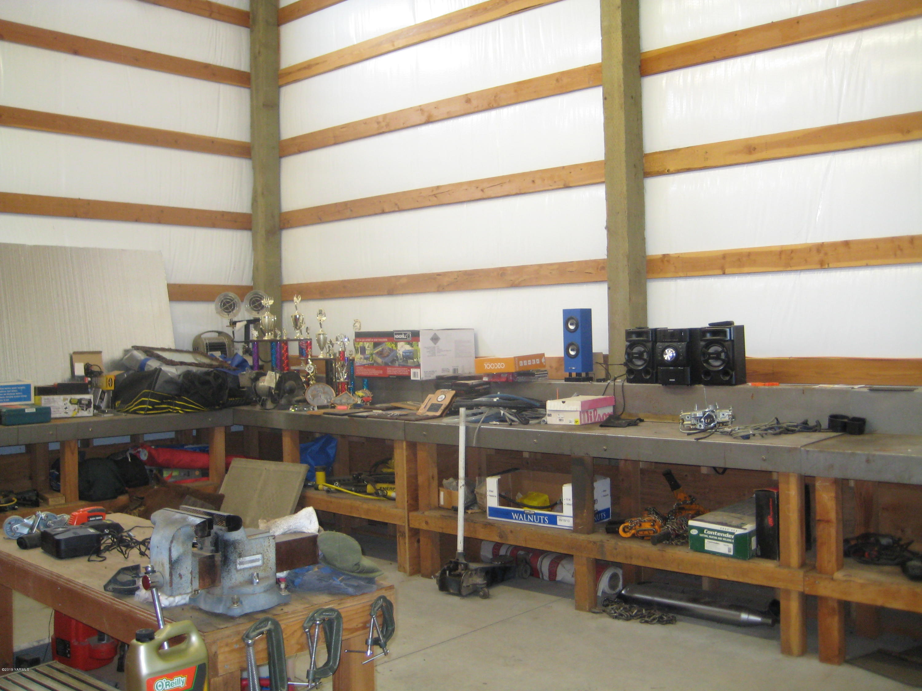5900 Ashue Road Wapato, WA 98951 - Photo 59 of 60 a room with furniture and a window