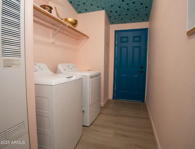 a view of a utility room with washer and dryer
