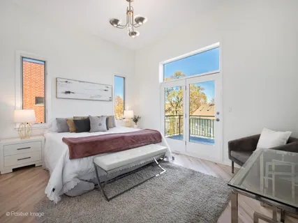 a spacious bedroom with a bed and window