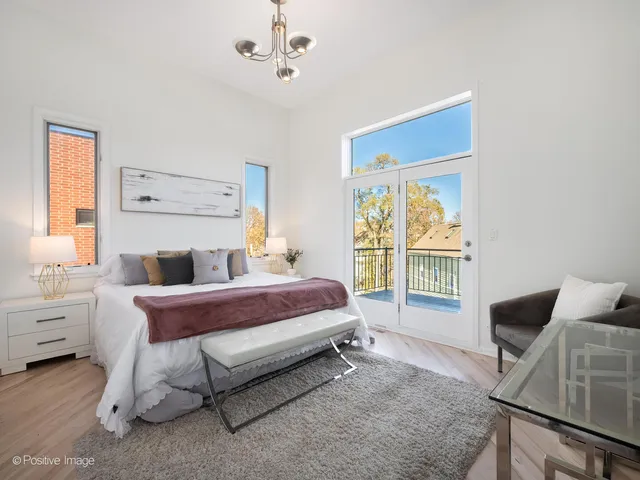 a spacious bedroom with a bed and window