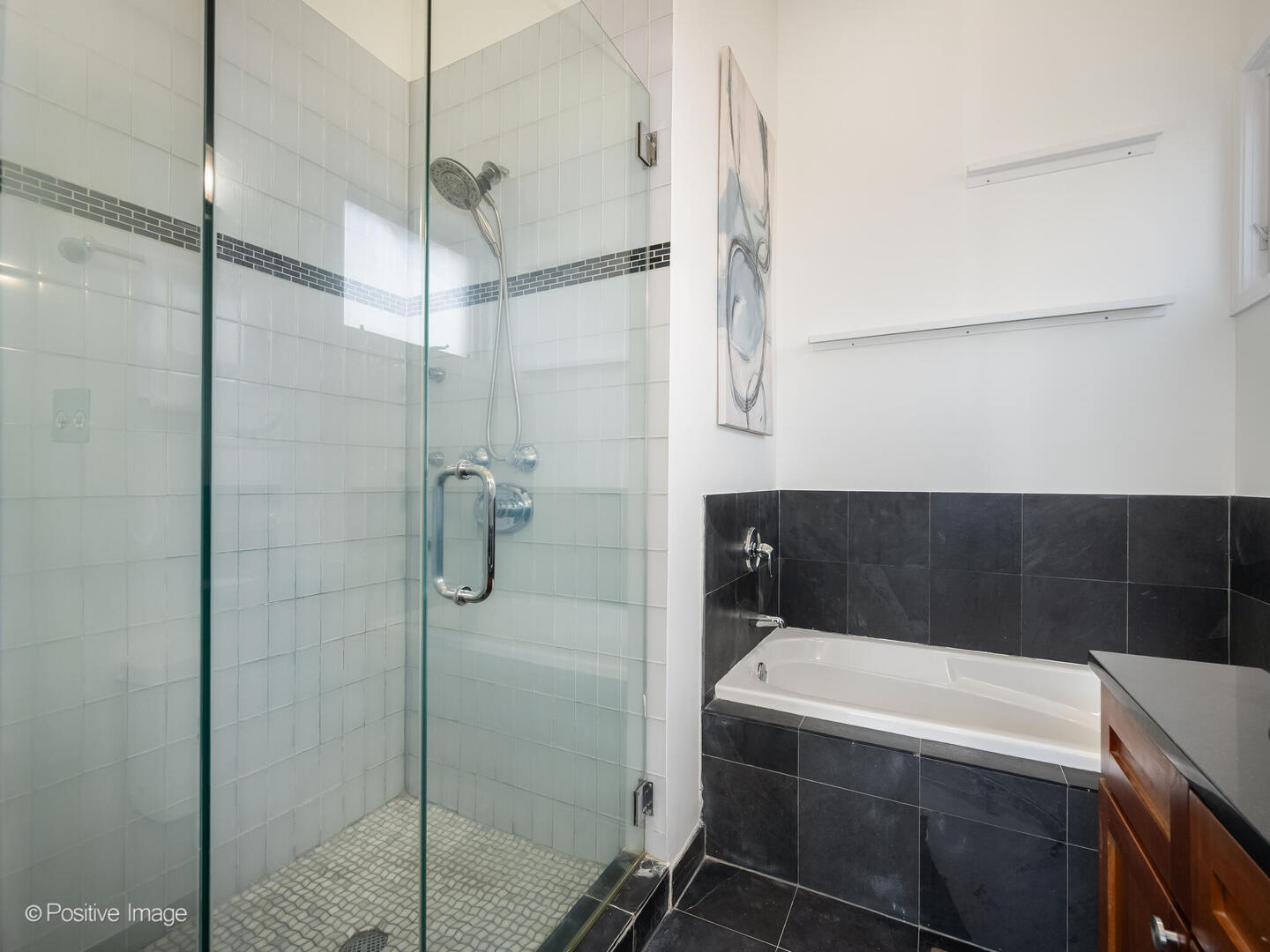 3053 North Clybourn Avenue, Unit 3 Chicago, IL 60618 - Photo 16 of 24 a bathroom with a tub and shower