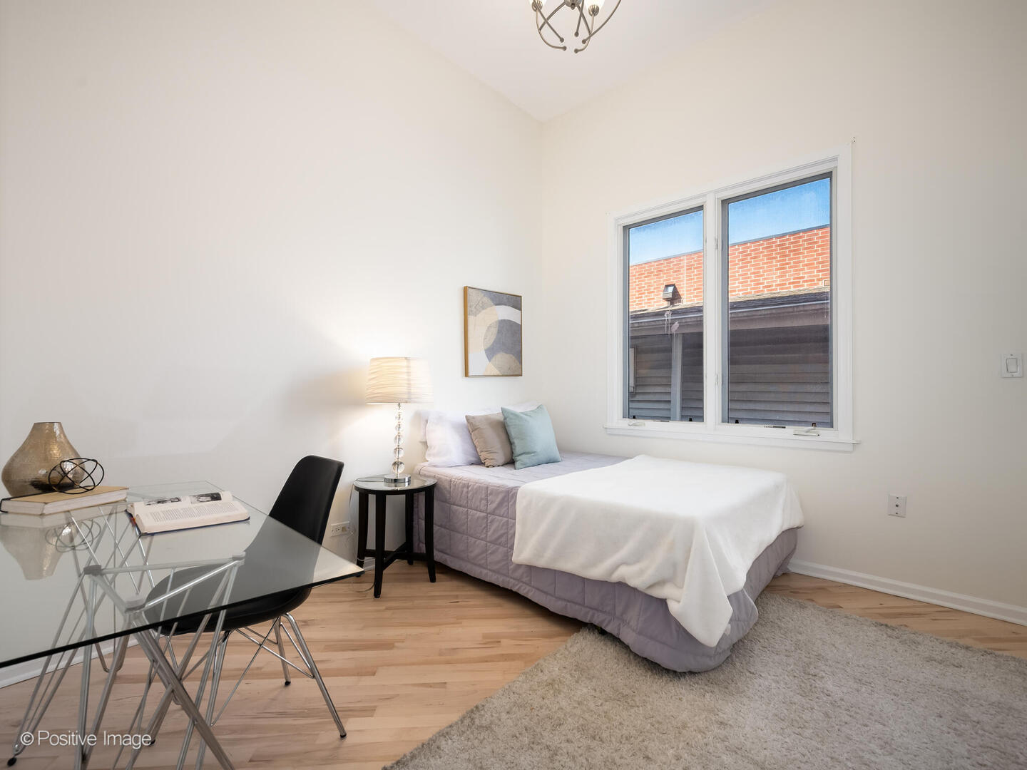 3053 North Clybourn Avenue, Unit 3 Chicago, IL 60618 - Photo 17 of 24 a bedroom with a bed and window