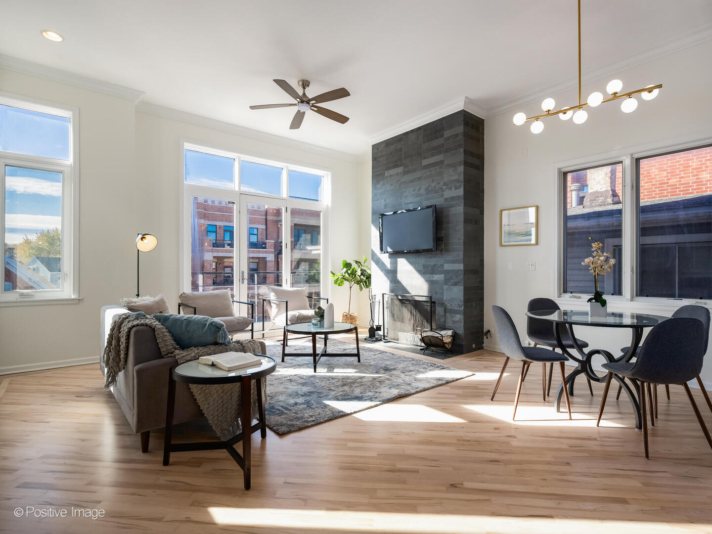 3053 North Clybourn Avenue, Unit 3 Chicago, IL 60618 - Photo 2 of 24 a living room with furniture and a chandelier