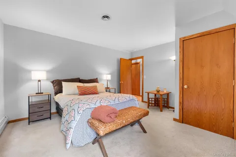 a bedroom with a bed and a table