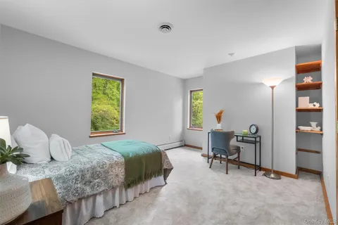 a bedroom with a bed and a table in it