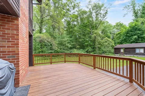 a view of balcony with wooden floor