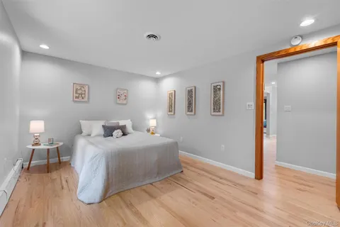 a bedroom with a bed and a lamp