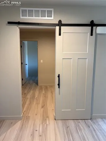a view of a livingroom with wooden floor