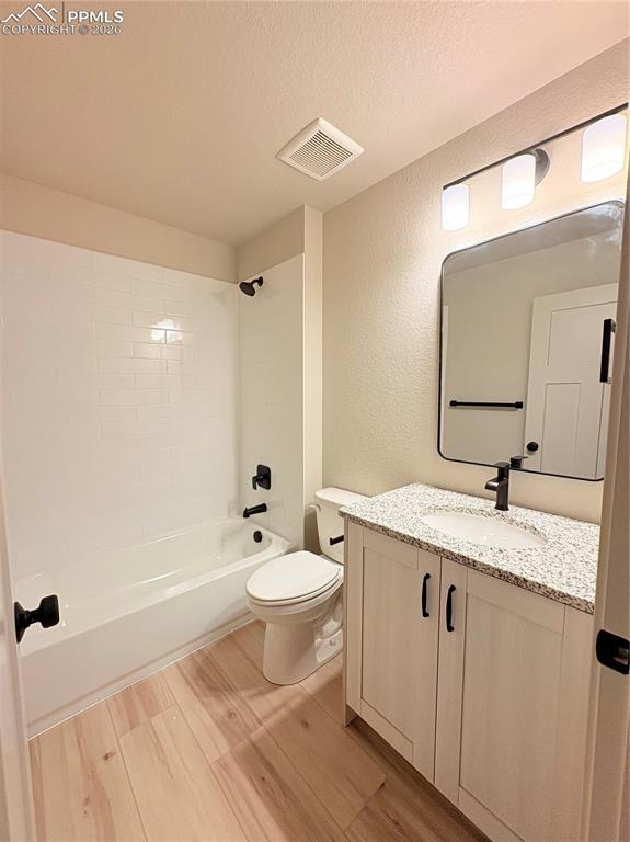 822 Keystone Loop Canon City, CO 81212 - Photo 7 of 14 a bathroom with a granite countertop sink mirror and toilet