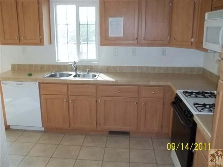 13442 Ocotillo Road Whitewater, CA 92282 - Photo 3 of 14 a kitchen with a sink a stove and cabinets