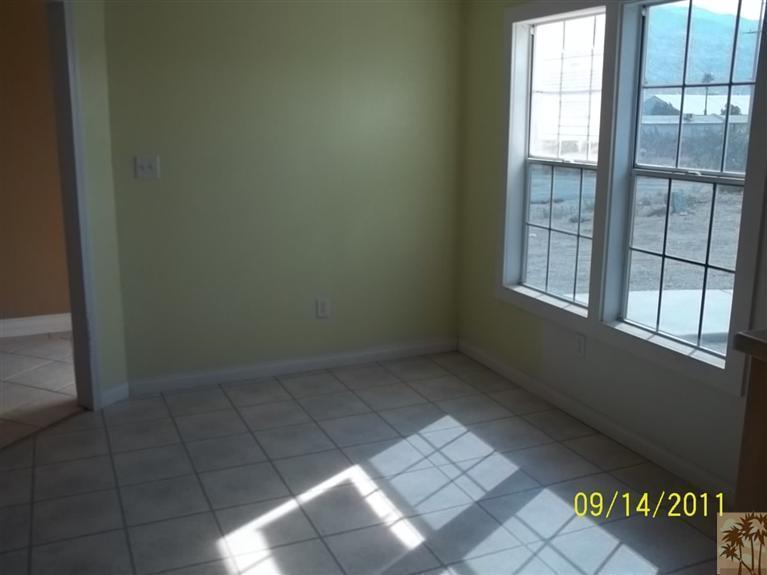 13442 Ocotillo Road Whitewater, CA 92282 - Photo 7 of 14 an empty room with windows