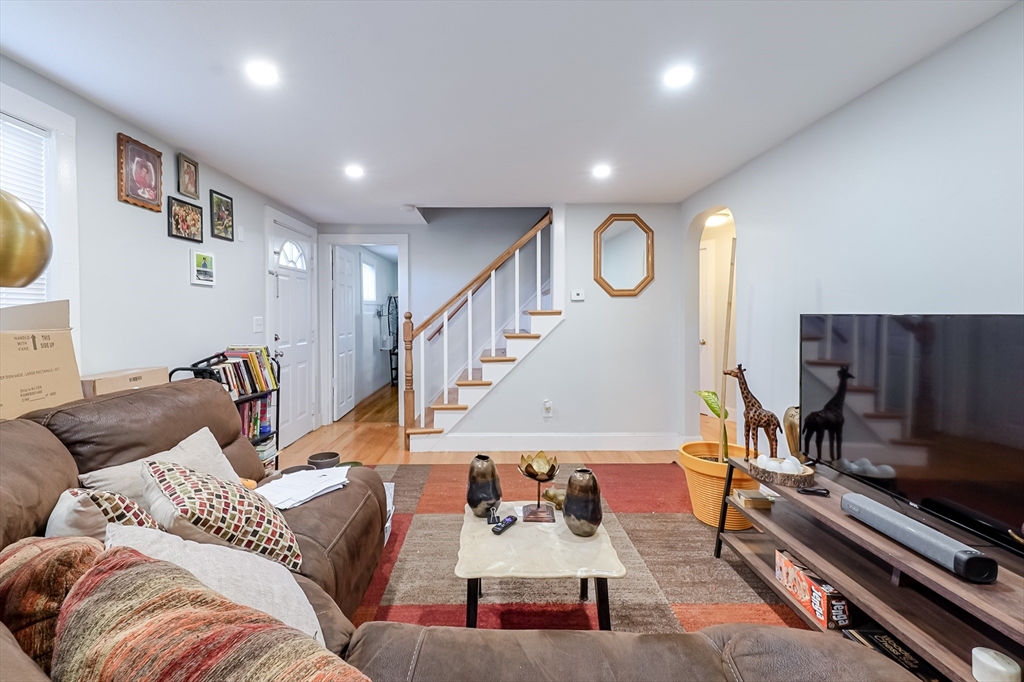 5 Oliver Street Randolph, MA 02368 - Photo 19 of 29 a living room with furniture and a flat screen tv