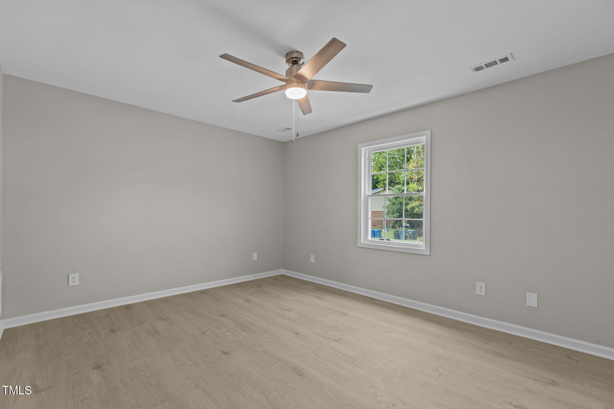 1433 Cherrycrest Drive Durham, NC 27704 - Photo 17 of 40 an empty room with ceiling fan and windows