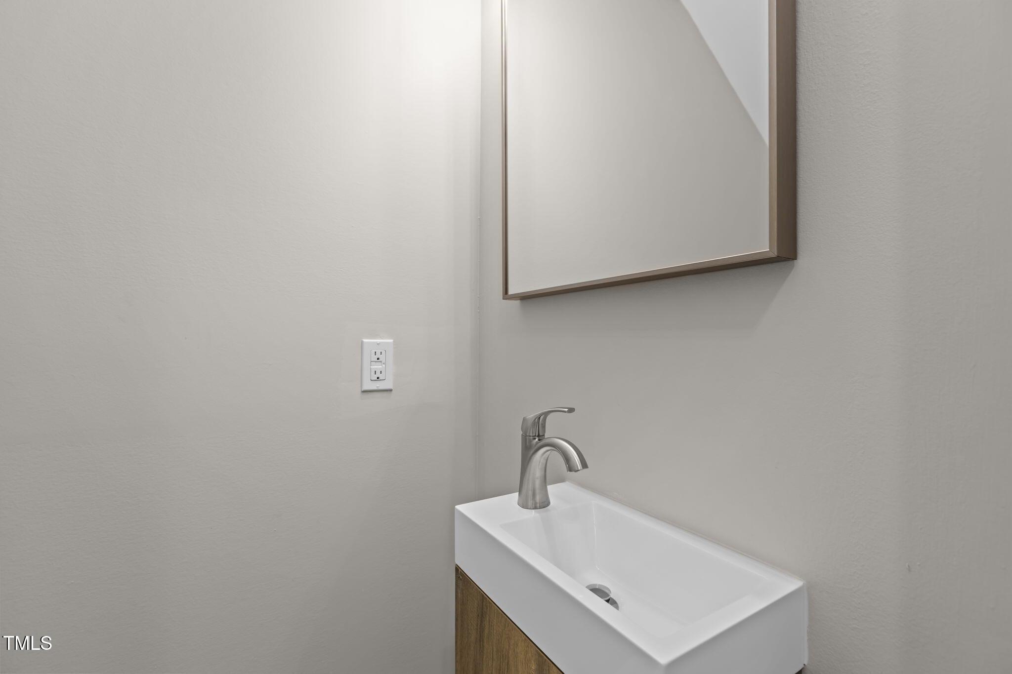 1433 Cherrycrest Drive Durham, NC 27704 - Photo 18 of 40 a bathroom with a sink and a mirror