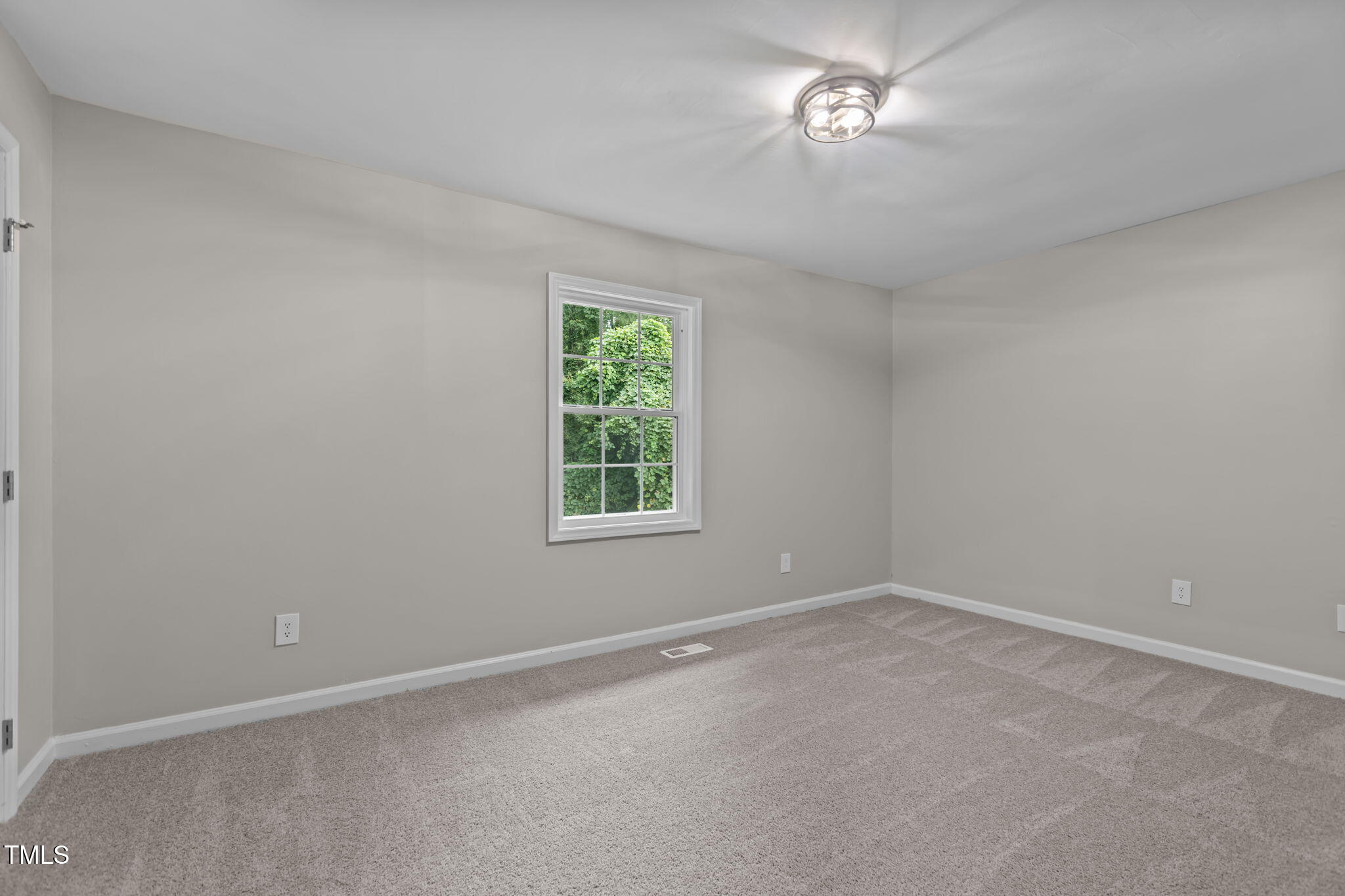 1433 Cherrycrest Drive Durham, NC 27704 - Photo 20 of 40 an empty room with a window