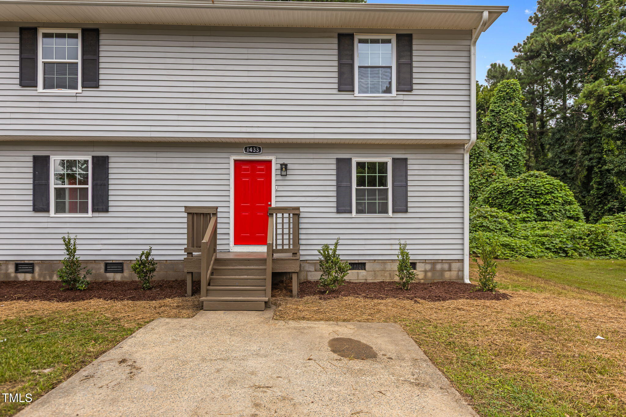 1433 Cherrycrest Drive Durham, NC 27704 - Photo 2 of 40 a view of a house with backyard and a trees