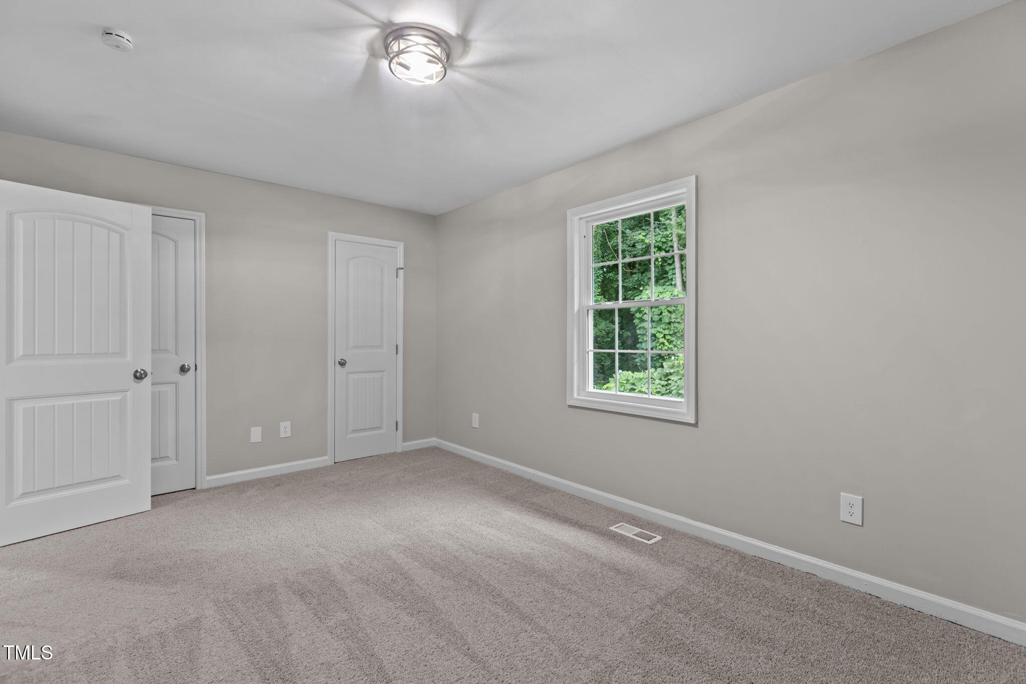 1433 Cherrycrest Drive Durham, NC 27704 - Photo 21 of 40 a view of an empty room with a window