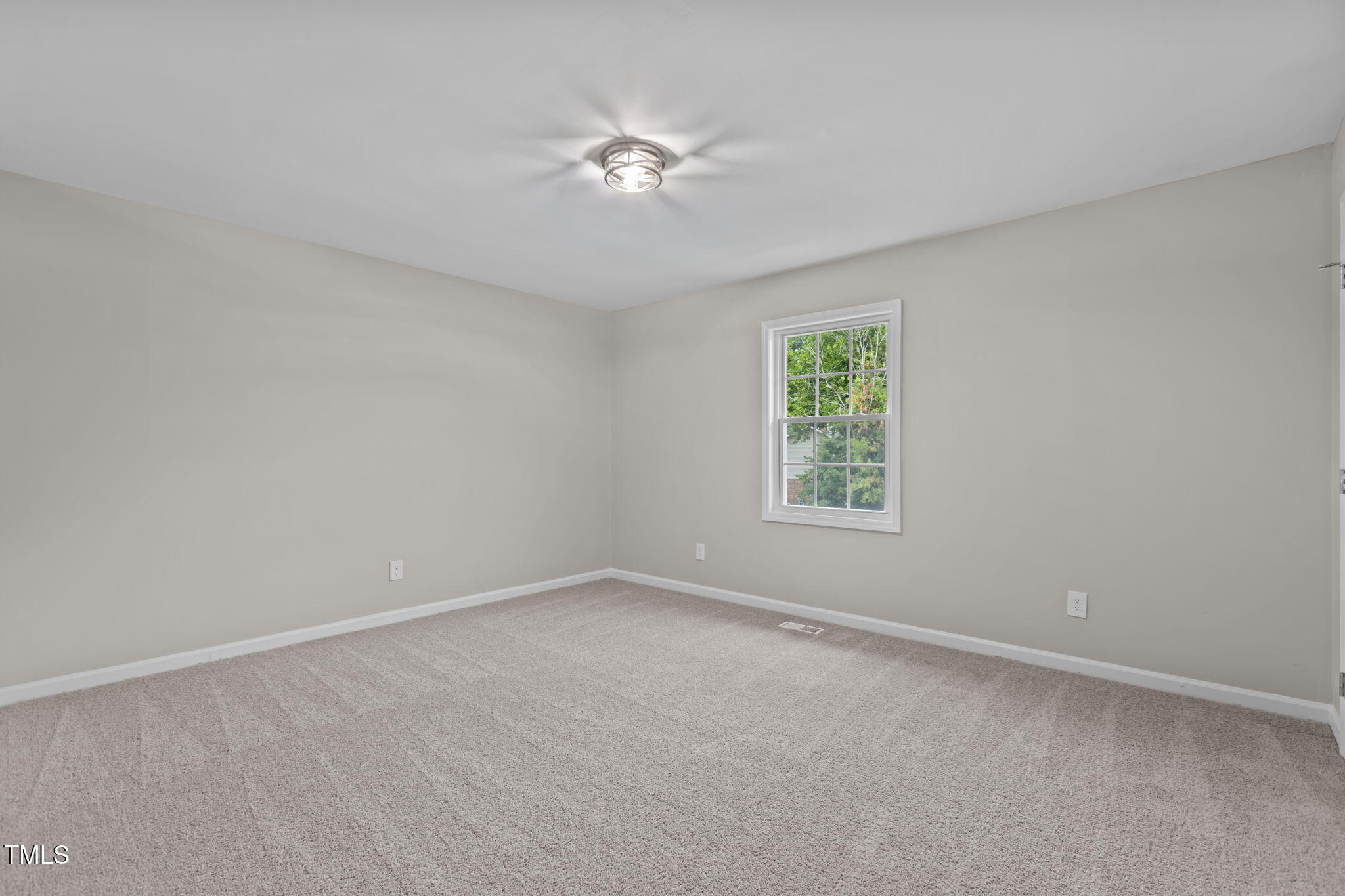 1433 Cherrycrest Drive Durham, NC 27704 - Photo 23 of 40 a view of an empty room with a window