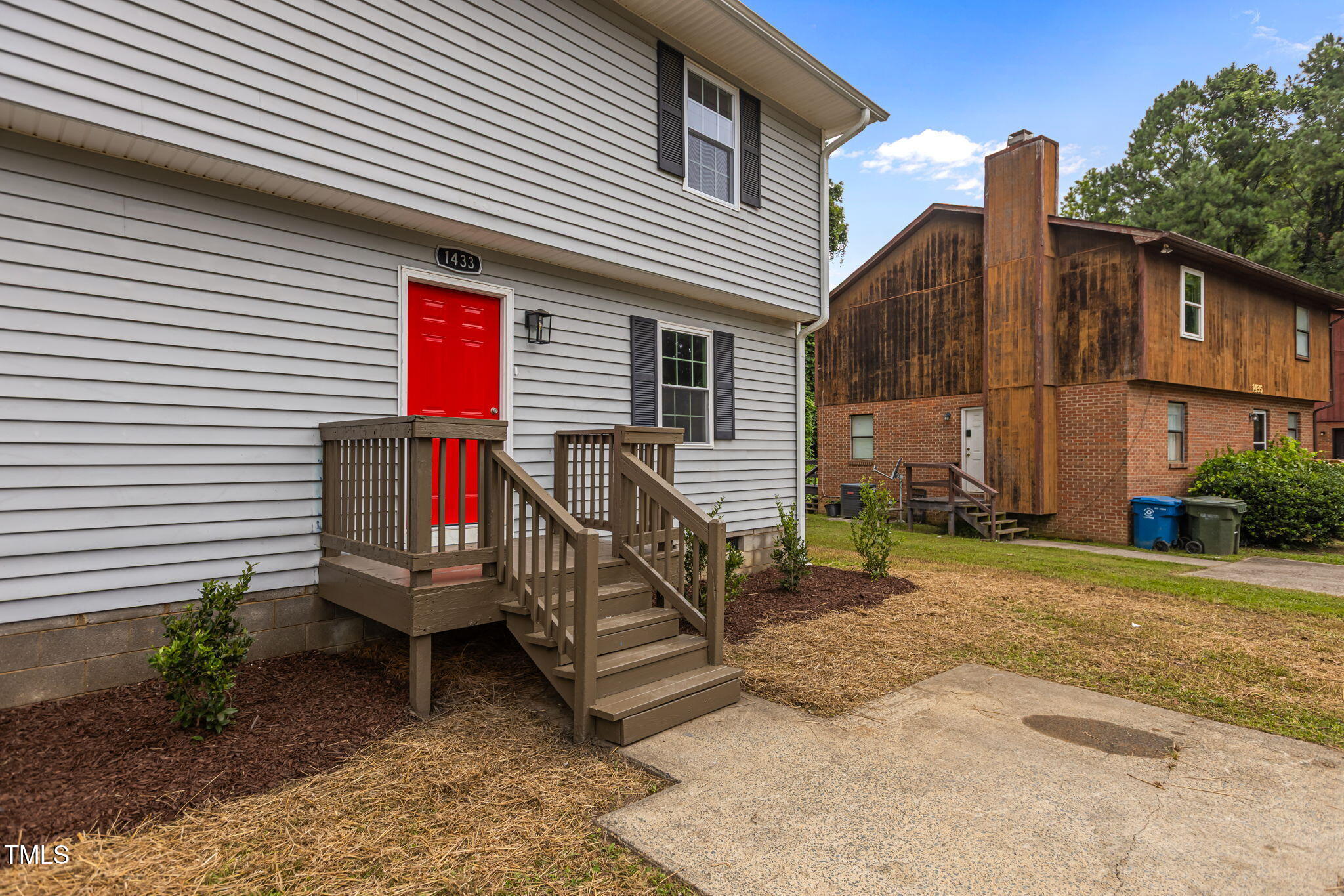 1433 Cherrycrest Drive Durham, NC 27704 - Photo 26 of 40 a view of a house with a yard and furniture