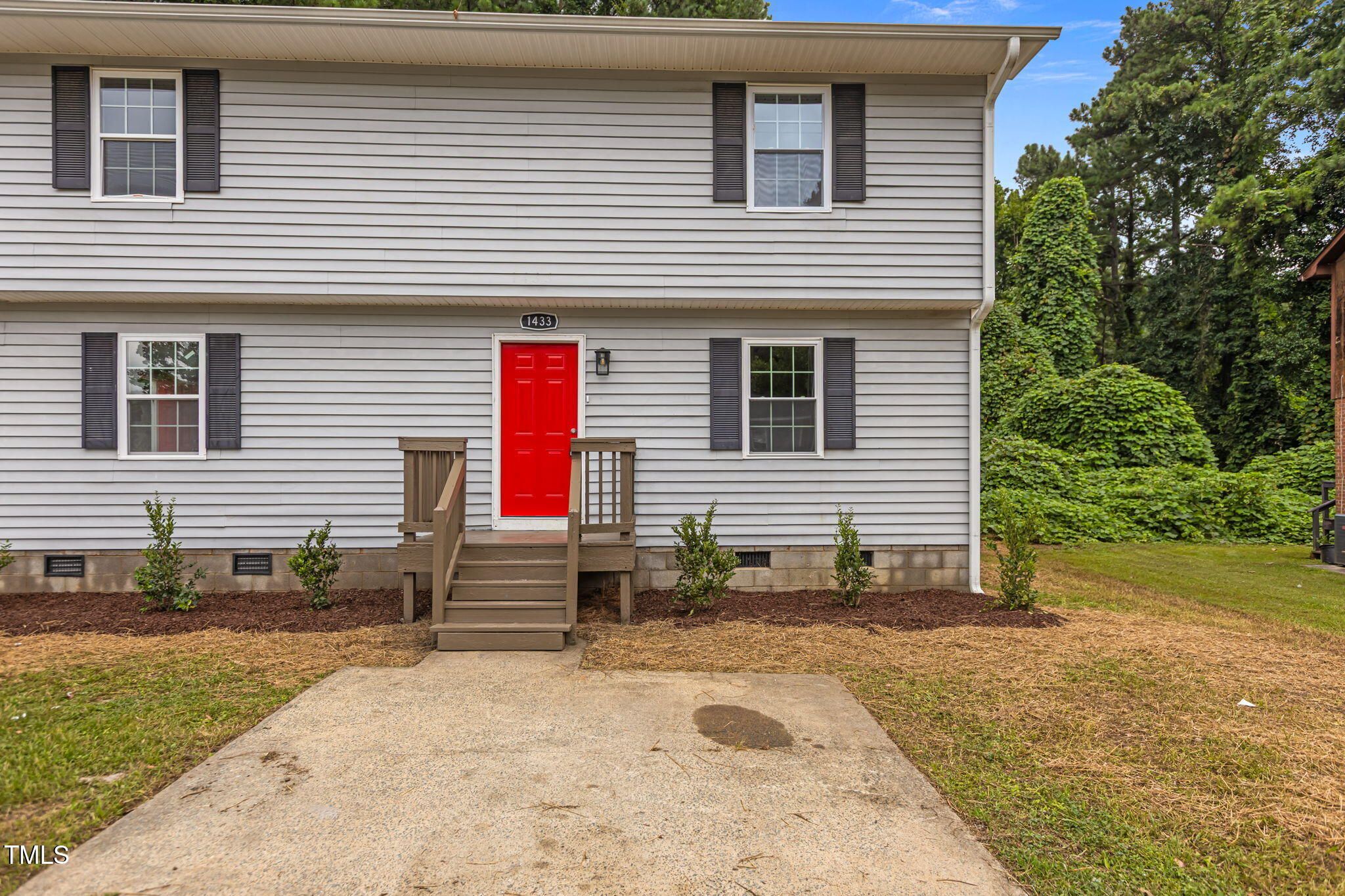 1433 Cherrycrest Drive Durham, NC 27704 - Photo 27 of 40 a view of a house with backyard and trees