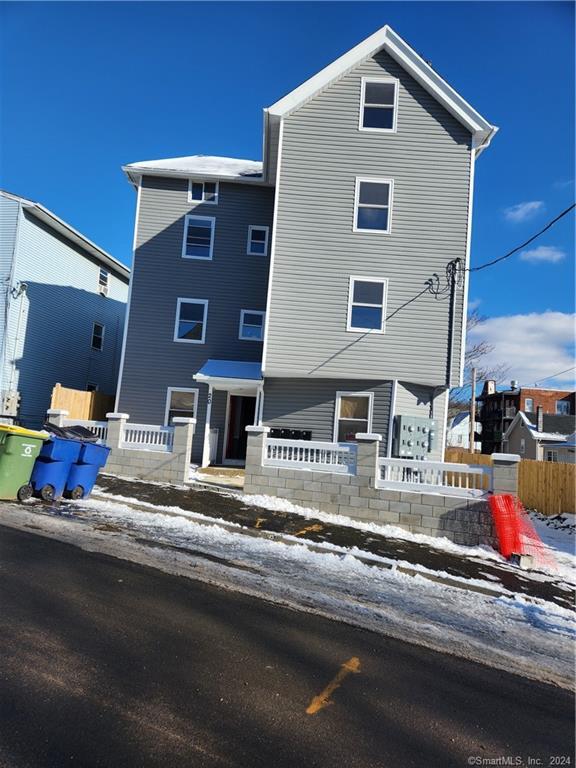 a front view of residential houses with street