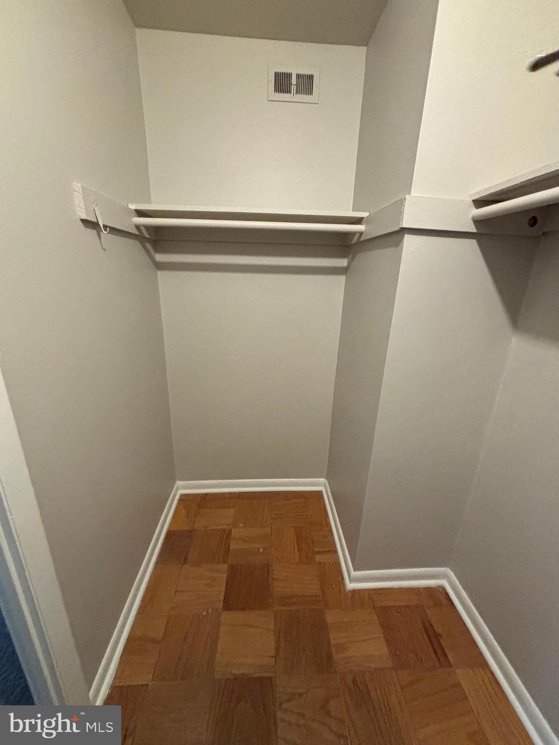 3853 St Barnabas Road, Unit 202 Suitland, MD 20746 - Photo 18 of 20 a view of a room with racks on the wall