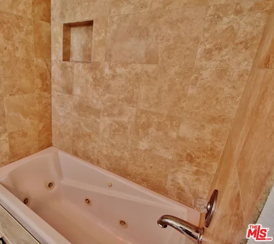 a view of a room with wooden floor and windows