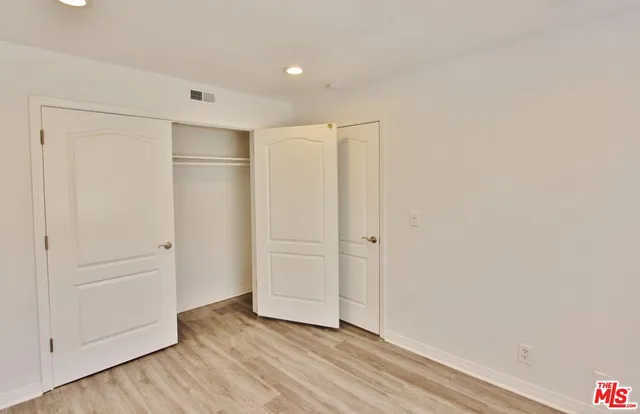 a view of a hallway with closet