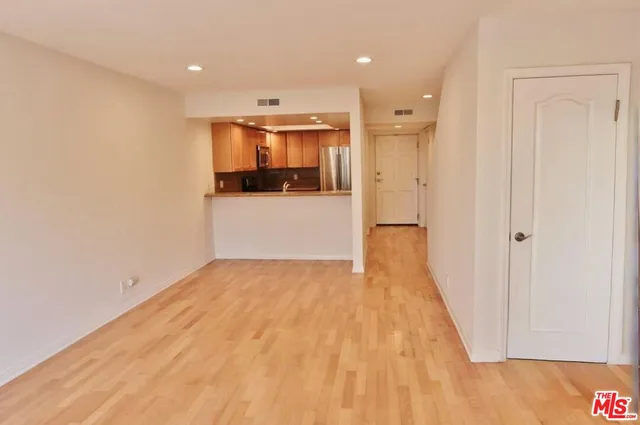 a view of hallway with wooden floor