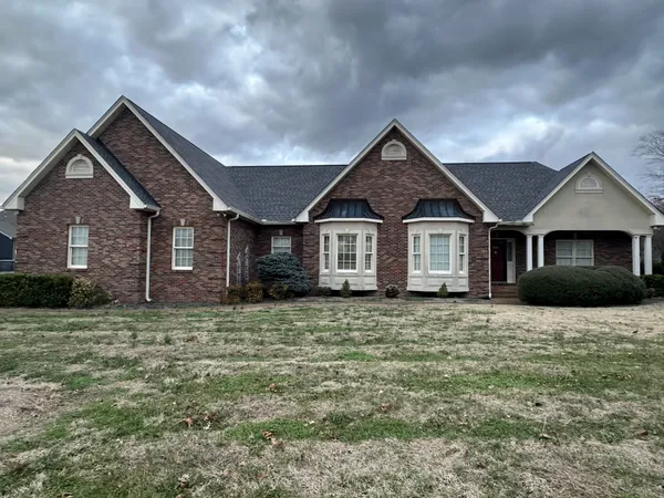 a front view of a house with a yard