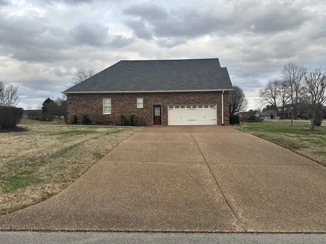 a house view with a garden space