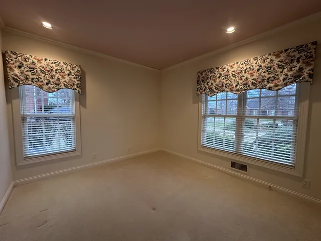 a en suite bathroom with a double vanity sink and a mirror