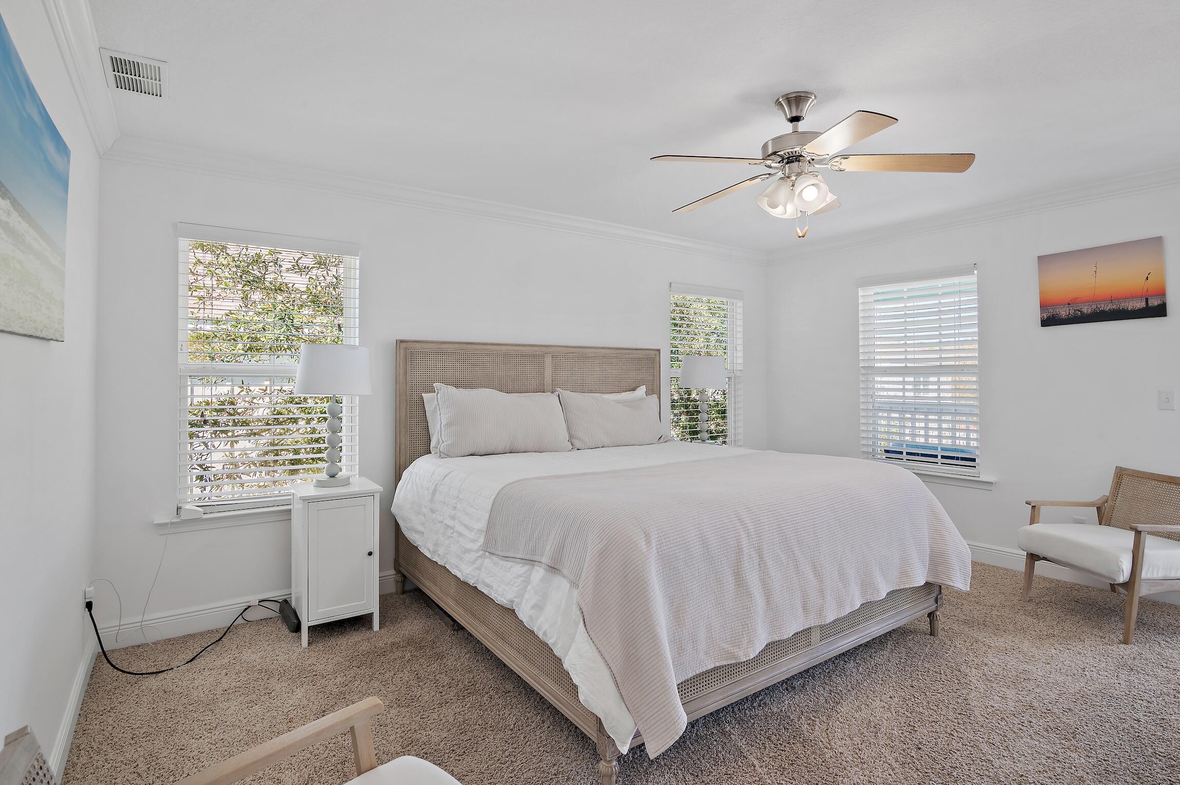 57 Grayling Way Inlet Beach, FL 32461 - Photo 4 of 8 a bedroom with a bed and a chandelier