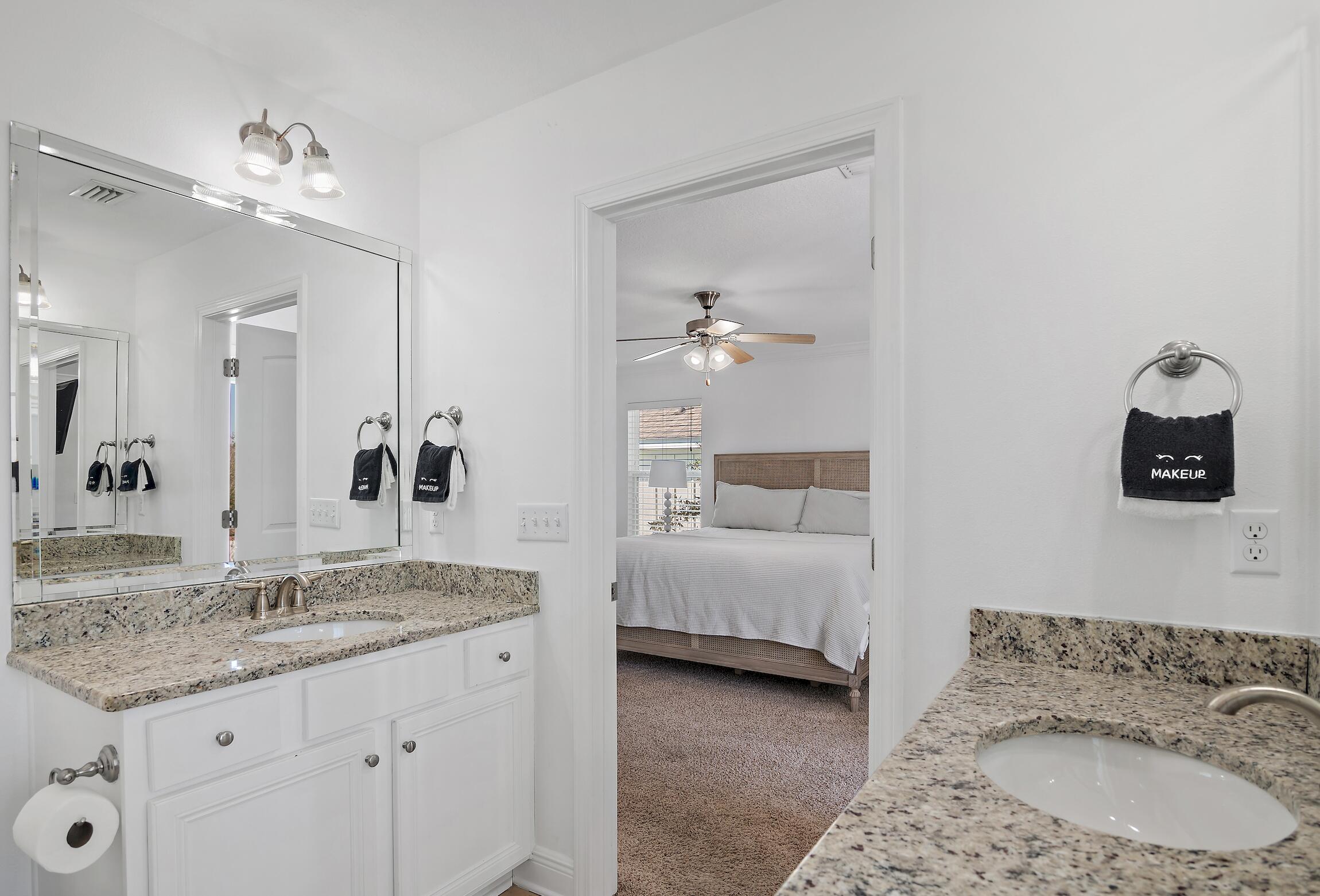 57 Grayling Way Inlet Beach, FL 32461 - Photo 5 of 8 a en suite bathroom with a granite countertop sink and a mirror