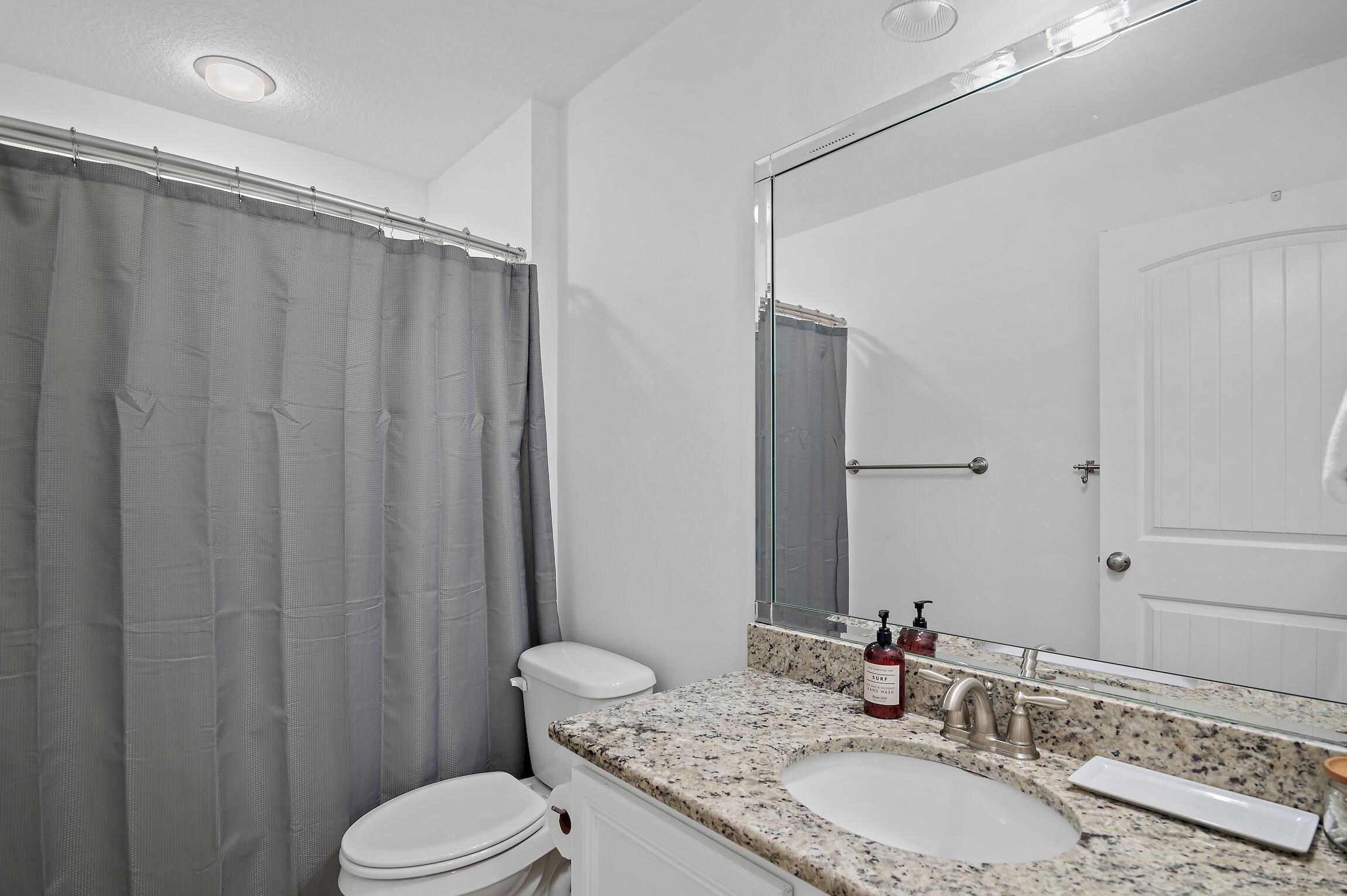 57 Grayling Way Inlet Beach, FL 32461 - Photo 7 of 8 a bathroom with a granite countertop sink toilet and shower