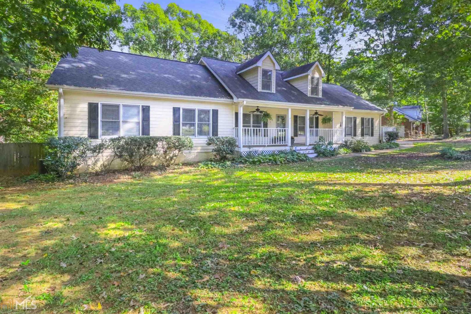 236 Williamsburg Circle McDonough, GA 30253 - Photo 1 of 1 a front view of a house with swimming pool