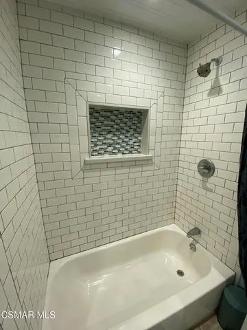 a bathroom with a bathtub
