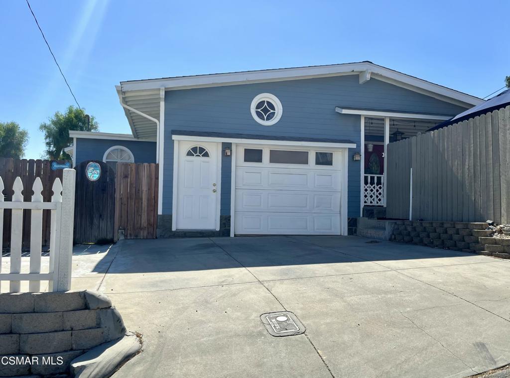 9333 Rowell Avenue Chatsworth, CA 91311 - Photo 2 of 25 a front view of a house with a garage