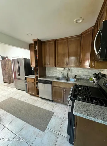 a kitchen with a cabinets and appliances