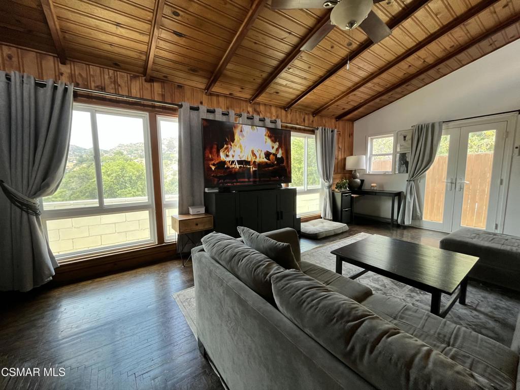 9333 Rowell Avenue Chatsworth, CA 91311 - Photo 8 of 25 a living room with furniture and a large window
