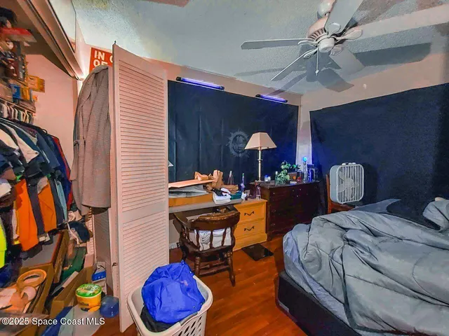 a bed room with a bed and a chandelier