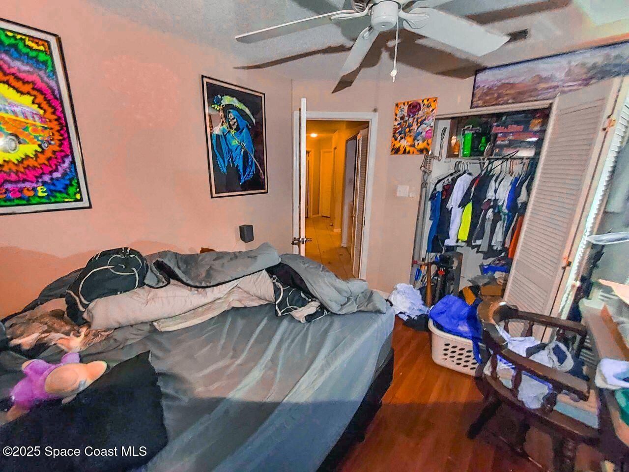1515 Huntington Lane, Unit 628 Rockledge, FL 32955 - Photo 12 of 18 a living room with furniture and wooden floor