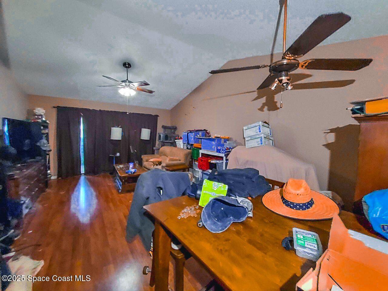 1515 Huntington Lane, Unit 628 Rockledge, FL 32955 - Photo 15 of 18 a view of a dining room with furniture a chandelier and wooden floor
