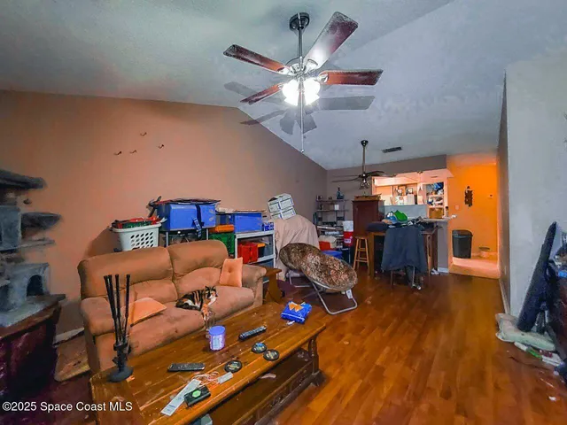 a living room with lots of furniture and a flat screen tv
