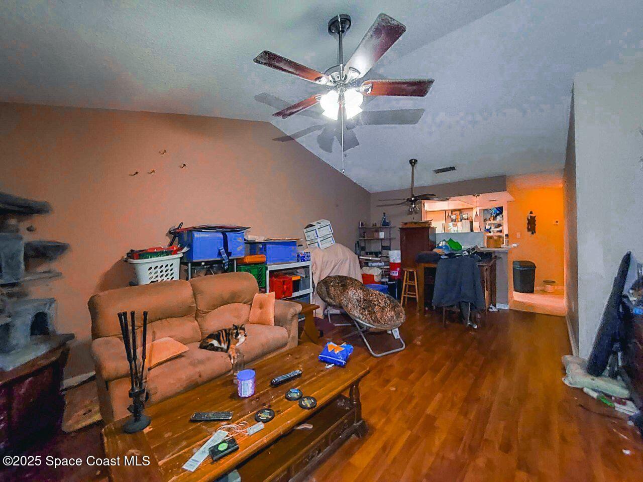1515 Huntington Lane, Unit 628 Rockledge, FL 32955 - Photo 16 of 18 a living room with lots of furniture and a flat screen tv