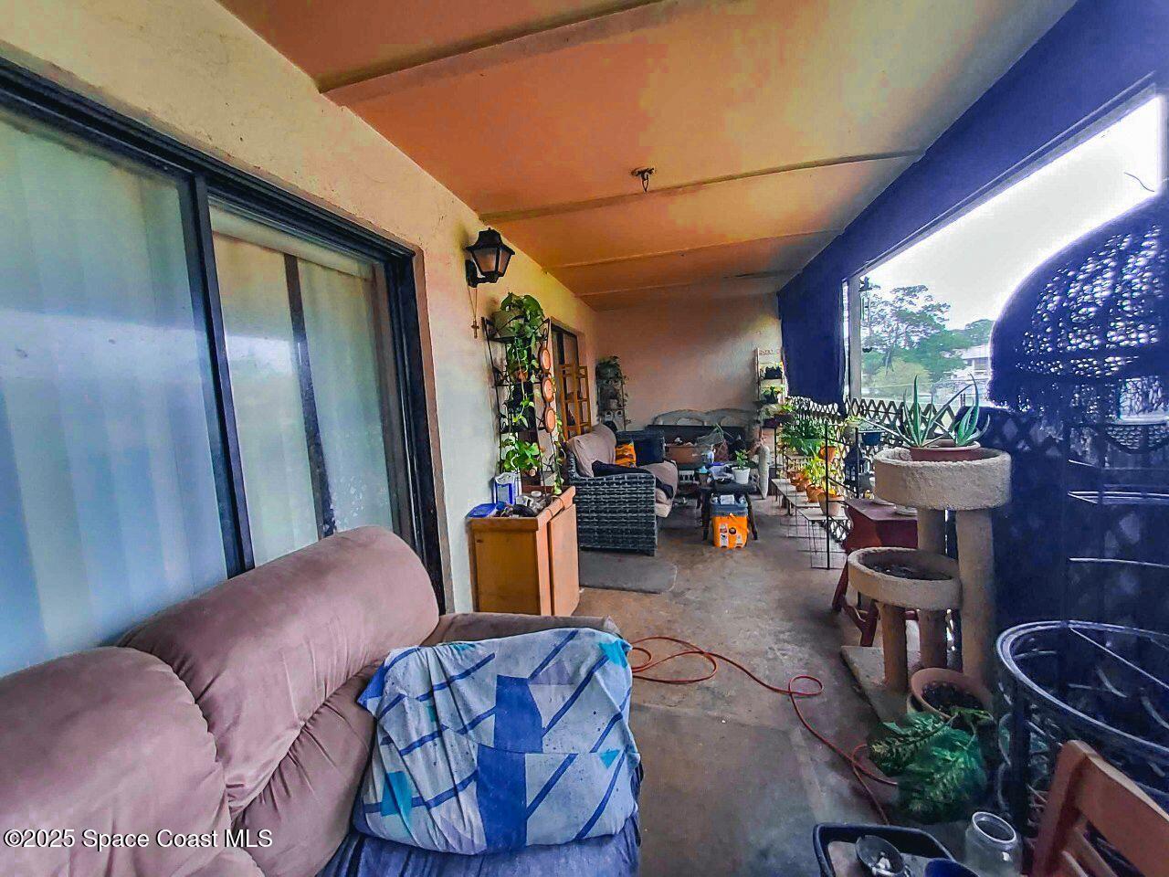 1515 Huntington Lane, Unit 628 Rockledge, FL 32955 - Photo 17 of 18 a living room with furniture and a fireplace