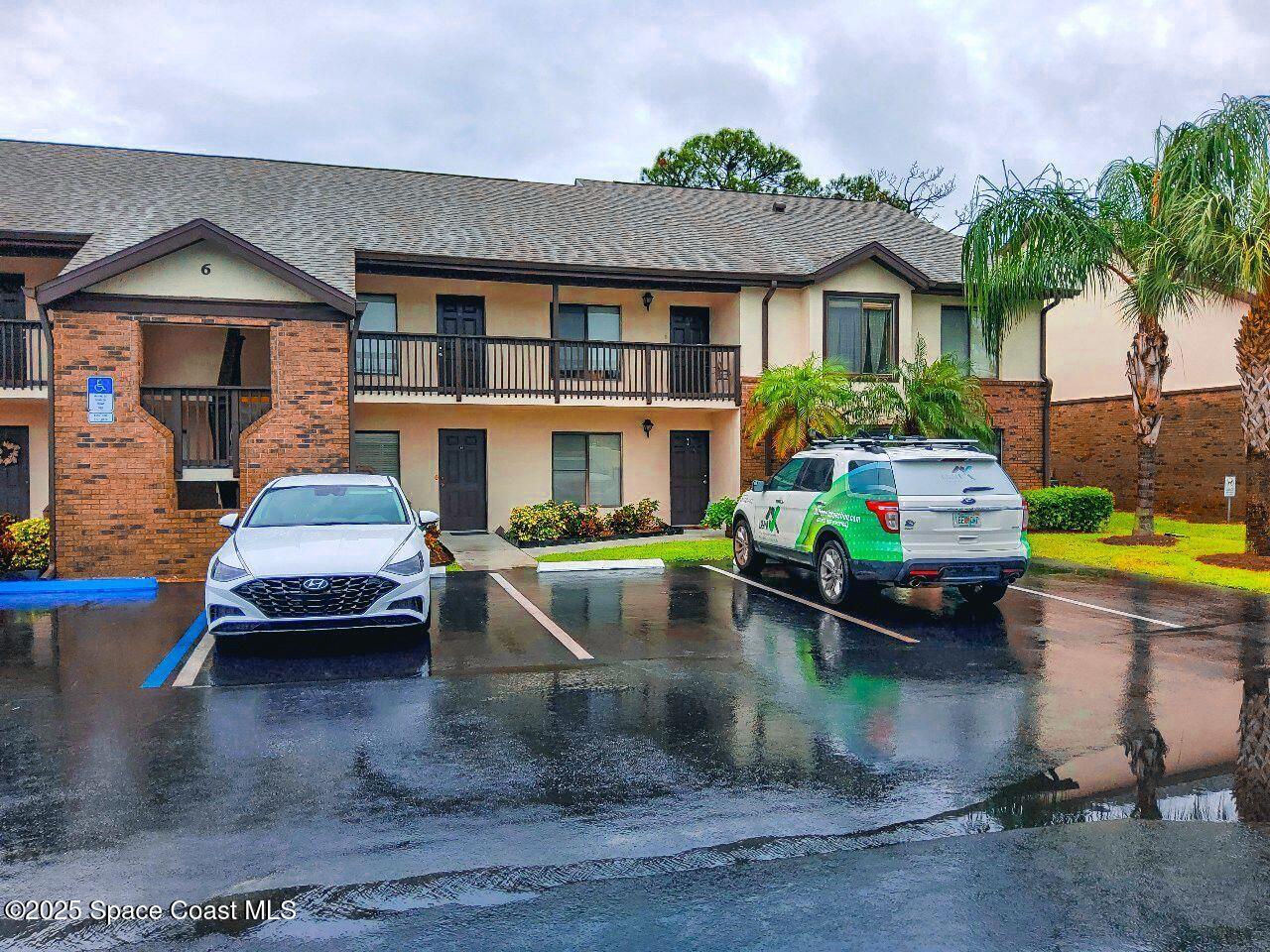 1515 Huntington Lane, Unit 628 Rockledge, FL 32955 - Photo 2 of 18 a swimming pool view with a outdoor seating