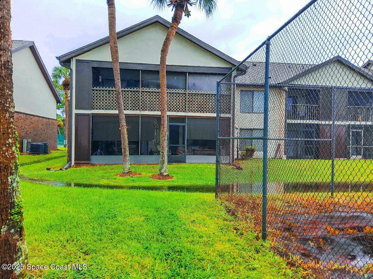 1515 Huntington Lane, Unit 628 Rockledge, FL 32955 - Photo 4 of 18 a view of an house with backyard and a garden