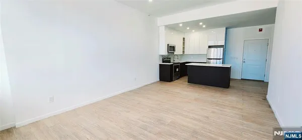 a bedroom with furniture and a flat screen tv