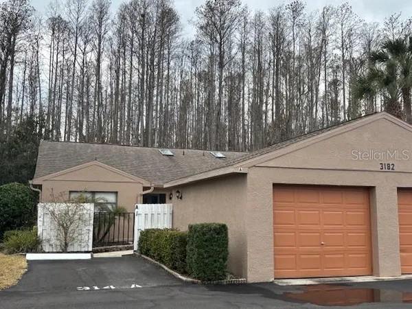 a front view of a house with a garage